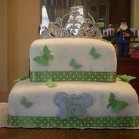 Quinceanera Cake I made this cake for my Niece's Quinceanera. This was my third fondant cake. The tiara was made out of royal icing and the butterflies...