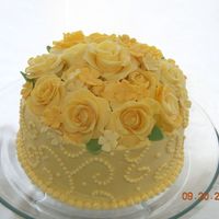Trina's Birthday Cake This cake was made for a cousin who loves yellow roses in memory of her mom.I got the idea of the overall look from a Wilton book. My Mom,...