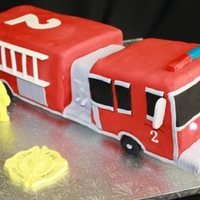Firetruck Choc cake. 11x15 pan cut & carved. 12 hours start to finish including board to elevate the truck so that only the wheels touch base....