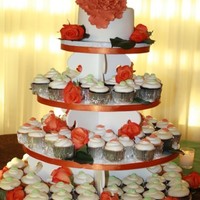 Peony Wedding Tower Peony made from gumpaste. Carrot cake with cream cheese filling covered in fondant. 120 cupcakes filled the tower to capacity.