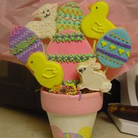 Easter Cookie Bouquet This is a sample of an Easter bouquet I will be selling as another fundraiser for my son. I handpainted the terra cotta pots.