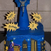 Batman Buttercream with fondant accents. Batman and Joker are christmas ornaments