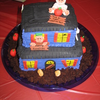 Haunted House Buttercream with fondant roof and accents.