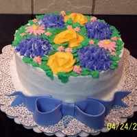Flowers And Bows All buttercream with a fondant bow
