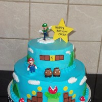 Mario Buttercream with fondant accents. The birthday boy likes Luigi the best so he is on the top of the cake.