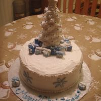 Christmas Tree & Presents This cake was made for our family christmas party. I made all the presents out of fondant and the tree is cookies and icing. It was a...