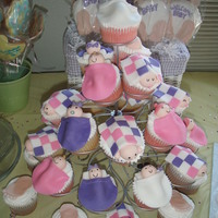 Tower Of Babies Cupcakes with fondant blankets and baby heads.