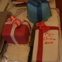 Christmas Presents I struggled with the round cake a bit, it's a bit lumpy. All in all, these went well. I used MMF and GP bows.