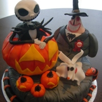 Nightmare Before Christmas Characters and cake covered in fondant. Pumpkin and the mayor are shaped from RKT. Thanks for looking.