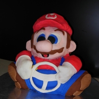 Wii Mario Cart Made this cake for a friend's son's Birthday. Used the bear pan and molded arms and hat out of RKT and covered with fondant....