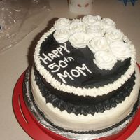Pict2118.jpg Made for my mom for her 50th birthday. First time doing roses. I wasn't completly happy with them. I made mistakes on this cake. It...