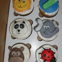 Animal Cupcakes I duplicated this design from another baker on CC and from aine2's monkey tutorial. MMF toppers. These were made for a party for an...