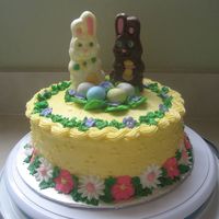 Happy Easter! Yellow cake with pineapple filling,buttercream icing and Royal icing flowers I learned at my Wilton course 2 class.