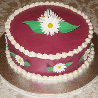 Burgandy Daisies This s made for a co-workers mothers birthday. It was my first paying cake.
