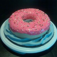 Doughnut Cake I apologize for the poor picture quality. I think my daughter ate the memory card for our camera so I had to take the photo with my phone....