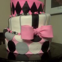 Graduation_Cake.jpg This was actually for a high school graduation but since there was no graduation theme, I put it here. This is also my first topsy turvy...