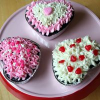 Valentine Mini-Cakes Double-chocolate cakes with buttercream frosting and candy toppers