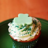 St. Patrick's Day Cupcake Vanilla cake, swiss meringue buttercream. Both flavored with creme de menthe.