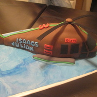 Helicopter Little guy asked Santa for a helicopter made of brownies so for his 3rd birthday on 12/29, we made a brownie cake with chocolate fondant....