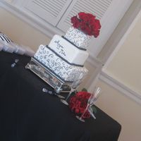 Scrolls & Roses Wedding Cake 6" cherry almond, 10" vanilla, 14" vanilla w/ fresh strawberries. Each tier has three 1.5" layers, fondant covered with...