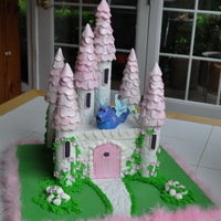 Pink Castle Cake Buttercream on the cake, fondant/gumpaste decor