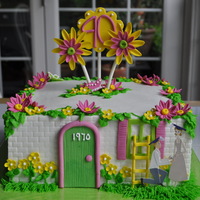 Elope Anniversary cake for a couple that eloped 40 years ago, on the night of their college graduation. Buttercream w gumpaste decor