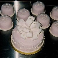 Mini Wedding we did an 8" with fondant bow and then minis... 45 - 4" cakes all of which had pearls around the base and in designs on top to...