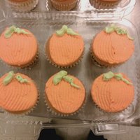 Pumpkin Cupcakes Some simple yellow cupcakes with whipped icing, made to look like pumpkins. :)