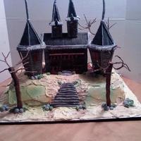 Haunted House Haunted House made with Fondant and Tree made with fondant and wire and bottom is covered with buttercream