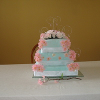 My First Wedding Cake MMF square Cake. Made this for My broter-in-law and new sister-in-laws wedding. The inside had 3 layers in each teir. Chocolatew/ chocolate...