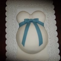 Baby Belly Cake Yellow cake with butter cream and fondant.