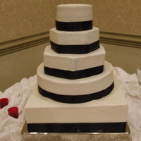 White Wedding Cake This cake is 5 tiers, the bottom tier is a dummy cake and is square, the next is round and was white cake with strawberry filling, the next...