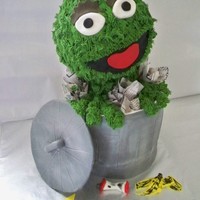 3D Oscar The Grouch 4- 8" rounds make the garbage can. His head is RKT covered with chocolate and buttercream.
