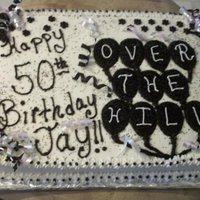 Over The Hill Cake All buttercream covering a white cake.