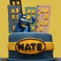 Batman I made this small Batman cake for my son to take to Kindy. I also made Batman cupcakes for all the kids. The cake was white chocolate...