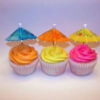 Tropical Cupcakes These cupcakes were done for a birthday party with a tropical theme. Umbrellas are the cheap drink favours found at most party stores.