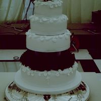 Wedding Cake white fondant covered wedding cake royal icing decorations with beautiful deep red roses