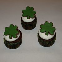 St. Patrick's Day Cupcakes Chocolate cupcakes, vanilla butter cream, and a chocolate sugar cookie to top it off.