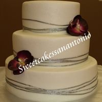 3 Tier Wedding Cake This was my final cake for a wilton course 3 class. It's butter cream with wired ribbon and fake flowers. I didn't have time to...