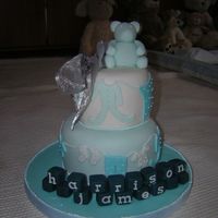 Dscn1713.jpg a stacked cake for the arrival of my nephew harrison james, fondant covered and freehand fondant cutouts of baby clothes ,fondant blocks...