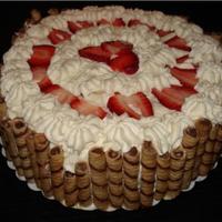 Mother's Day 2009 Plain yellow cake with whipped topping made from whipping cream. I got the pirouette border idea from a babyshower cake I saw here. I can&#...