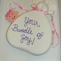 Bundle Of Joy This was one of my very first fondant cakes and I was still making all of my fondant from scratch. The design is from the wilton web site....