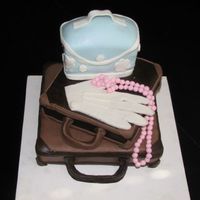 Traveler Chocolate WASC w/ Chocolate IMBC covered in chocolate fondant & MMF. Gloves & necklace made of gumpaste