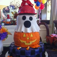 Halloween Birthday Cake Little Red Riding Hood's skirt is made from using the one half wilton ball pan. The torso and up is a doll found in the craft section...