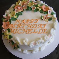 Michelles Birthday Yellow cake, buttercream frosting, gumpaste flowers & leaves