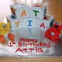 Sesame Street Babies Building Blocks Cake Blocks with edible images, Elmo and Big Bird made of fondant. Figures were more fun to make then those blasted blocks! lol