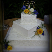 50Th Anniversary Cake This was a 3 tier iced in buttercream with fondant accents, sugar pearls, & gumpaste brooches painted with gold highlighter!
