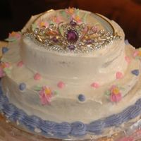Princess Birthday Cake A cake I made for my little sister turning 8. 6in yellow cake and 8in devils food cake filled with strawberry jam. All buttercream, tiara...
