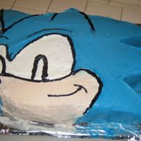 Sonic Birthday Cake. All buttercream with black piping. My Fiance decided he had to be cool and help, so I blame all imperfections on him. No character pan,...