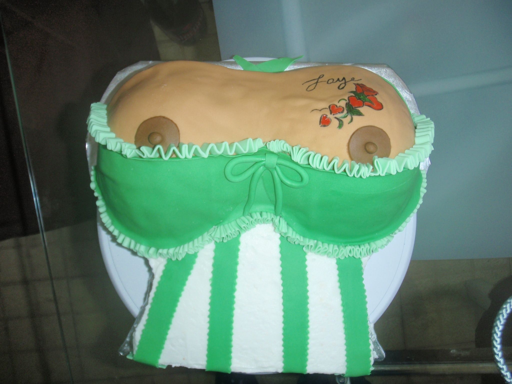 Tattooed Boobies I did this cake for a woman who wanted to give her husband a personal cake for his birthday. The tattoo was hand-painted from her tattoo...